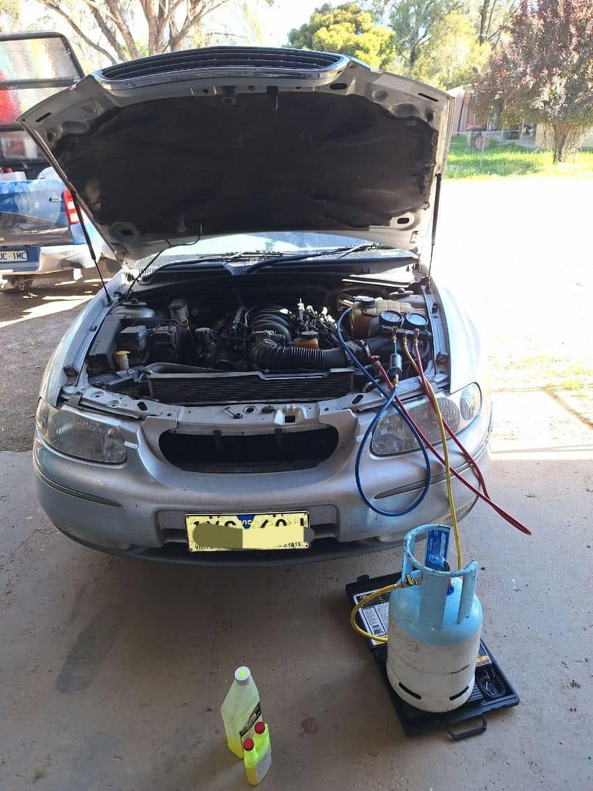 Ford AC regas in customer driveway