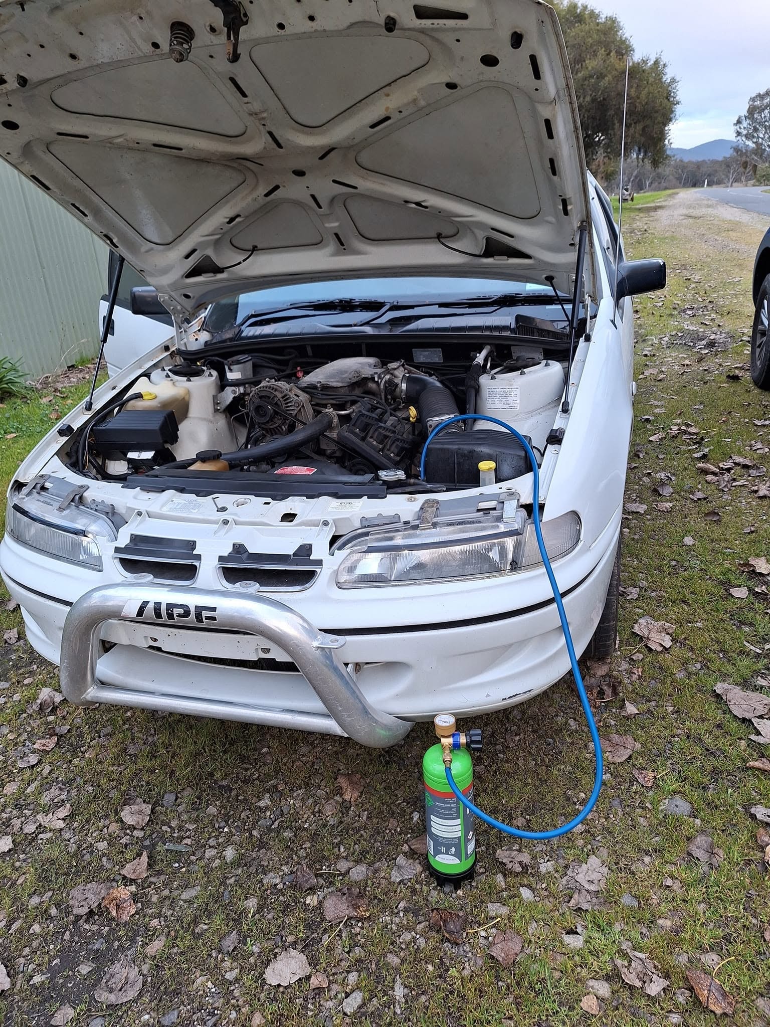 White car AC regas roadside service